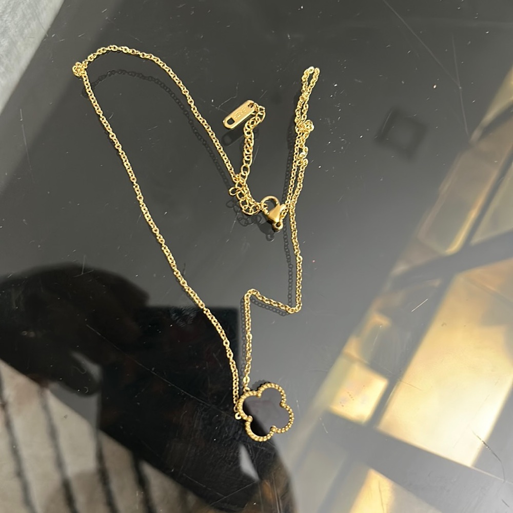 Black clover necklace.